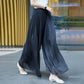 Glanset is silke gulvlang, bredbent culottes