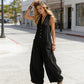 🌞Spring Awakening: 49 % rabatt! Elegant jumpsuit med V-hals: Ermeløs jumpsuit med knappestolpe i en avslappet passform