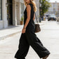 🌞Spring Awakening: 49 % rabatt! Elegant jumpsuit med V-hals: Ermeløs jumpsuit med knappestolpe i en avslappet passform