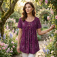 Plissert tunika for dame med blomsterprint