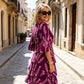 Elegant lagdelt midi-kjole med blomsterprint